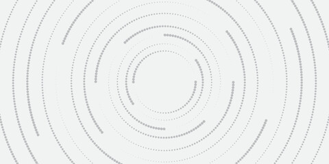 Minimalist abstract image featuring concentric dotted circles in shades of grey on a light background, creating a modern and tech-inspired circular pattern.