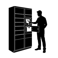 Man using a self-service parcel locker, retrieving a package via touchscreen interface.