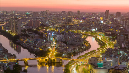 Obraz premium Panoramic view of Saigon, Vietnam from above at Ho Chi Minh City's central business district. Cityscape and many buildings, local houses, rivers. Landscape concept.