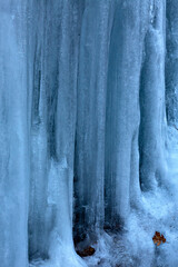 Tall ice formations with notches, on a cliff in Connecticut.