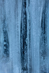 Tall ice formations with notches, on a cliff in Connecticut.