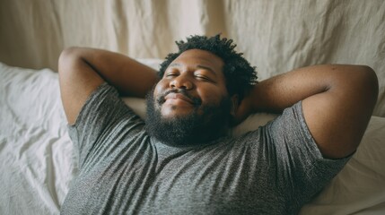 A relaxed man enjoying a moment of peace while reclining on a soft bed, embodying tranquility and comfort.