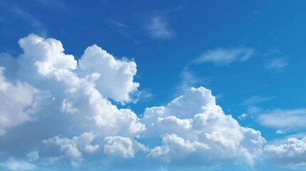 A serene blue sky adorned with fluffy white clouds, evoking a sense of peace and tranquility in nature.