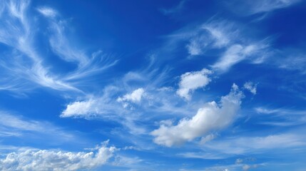 A serene cloudscape against a bright blue sky, perfect for conveying tranquility and natural beauty.
