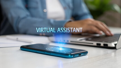 Person typing on laptop with virtual assistant hologram over phone