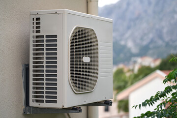 Heat pump mounted outside residential building