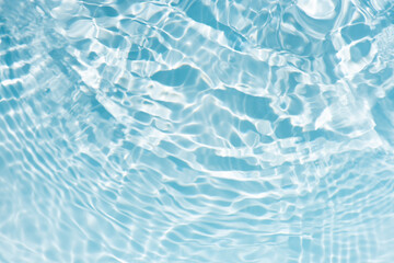 Blue water with ripples on the surface. Defocus blurred transparent blue colored clear calm water...