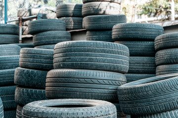 Used Worn Out Car Tires Piled Outdoors