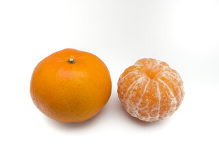 Isolated orange fruit. A collection of whole oranges and one peeled orange isolated on a white background.