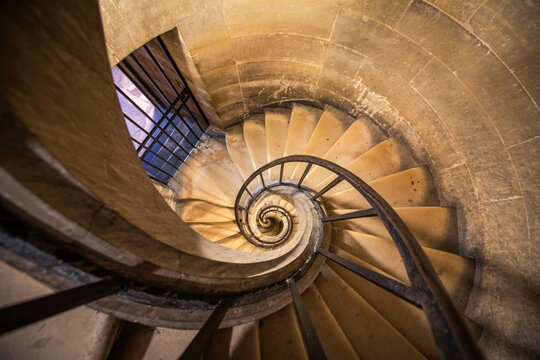 A vintage medieval spiral staircase in Paris Pantheon 