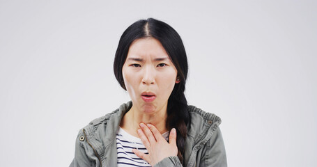 Cough, portrait and sore throat with woman on studio space for cold, flu or virus symptoms. Asthma,...