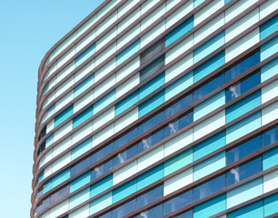 A building with blue and brown stripes and windows