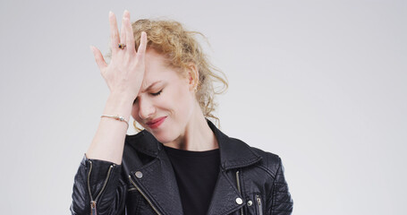 Headache, stress and woman in studio, pain and mental health on white background. Mockup space,...