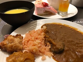 curry and rice with soup and cakes