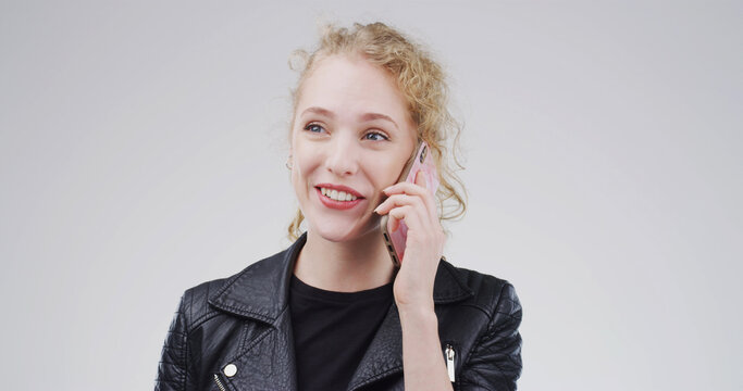 Happy woman, phone call and talking in studio for communication on a white background. Female person, blond or model speaking with smile on mobile smartphone for friendly discussion or chat on space