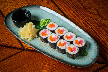 Savor the vibrant colors and textures of fresh sushi rolls with ginger and wasabi