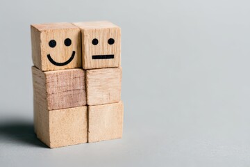 Obraz premium Wooden blocks depicting contrasting emotions highlighting the dual nature of happiness and neutrality showcasing the balance between joy and indifference in visual communication and emotional