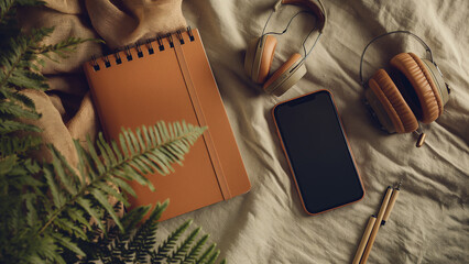 Flat-lay of cozy study setup in earthy tones with books, notes, and warm accents for calm workspace vibe. Back to school.