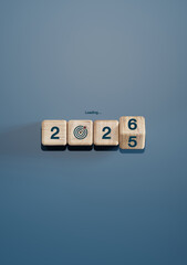 Wooden cubes forming year 2025 turning into 2026 with target icon and "Loading..." text. Concept of New Year goals, planning, transition, and business success.