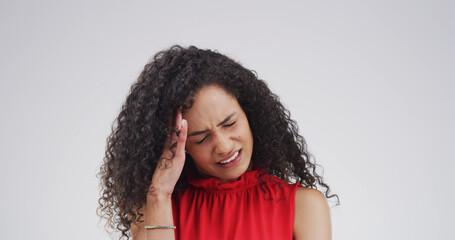 Pain, headache or woman with stress in studio for financial crisis, anxiety or overwhelmed by debt....