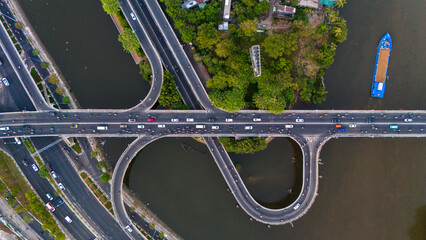 Top view of traffic on Nguyen Van Cu bridge. Panoramic view of Saigon, Vietnam from above at Ho Chi Minh City's central business district.