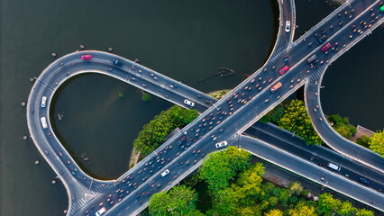 Top view of traffic on Nguyen Van Cu bridge. Panoramic view of Saigon, Vietnam from above at Ho Chi Minh City's central business district.