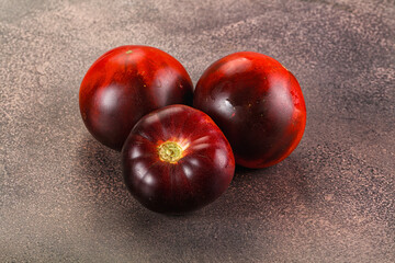 Black ripe juicy organic tomato