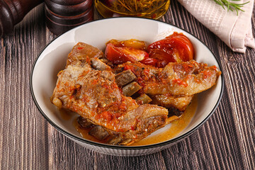 Baked lamb ribs with vegetables