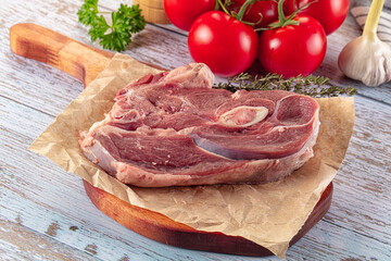 Raw lamb steak with bone