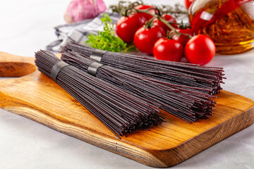 Raw black rice noodles lines
