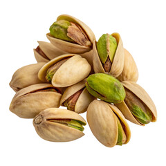 Closeup shot of pistachios in their shells isolated on a black background revealing green nuts