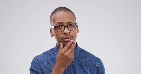 Portrait, thinking and black man with question in studio for why, suspicious and solution to doubt....