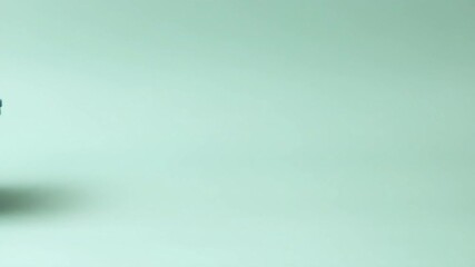 A sleek teal storage container on a soft pastel background.