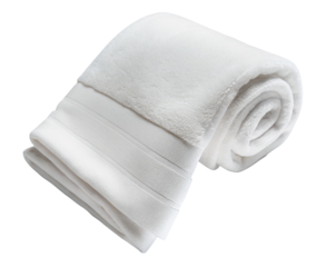 Soft white towel rolled neatly on a surface showing texture and fabric details of the towel