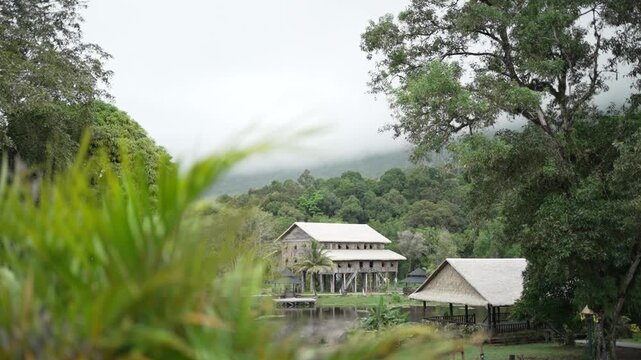 A track shot of a row of longhouses in rural parts of Malaysia