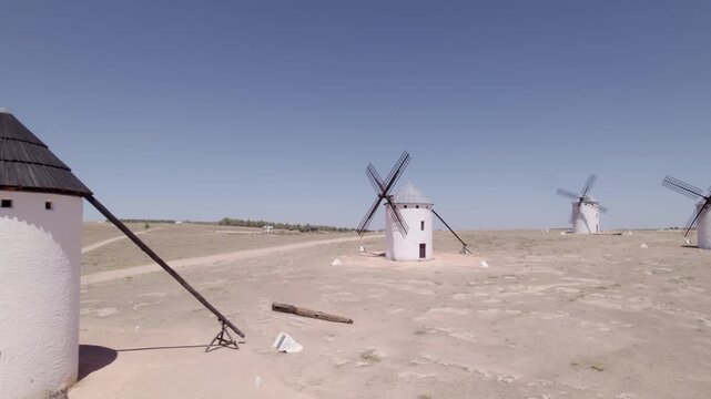 La Mancha. Spanish windmills. Aerial tracking shot. Don Quixote. Panoramic view of ancient windmills at midday. Campo de Criptana. Spain.