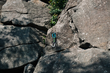 quickdraw for climbing hanging on a rock in Stockholm Sweden