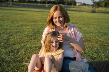 Middle age woman with her toddler girl daughter