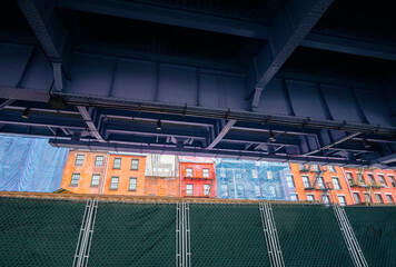 View of a group of buildings from below a bridge in New York