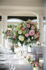 Tall Wedding Centerpiece with Pastel Flowers in Elegant Receptio