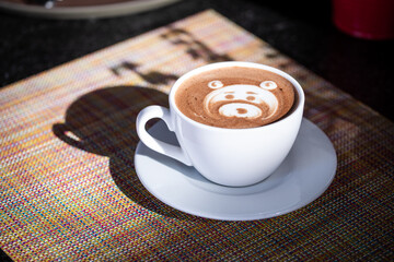 Frothy Latte with Foam Art in Morning Light