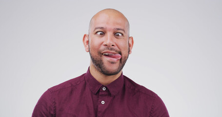 Silly, cross eyes and man in studio with funny face for playful, comedy and humor on white...