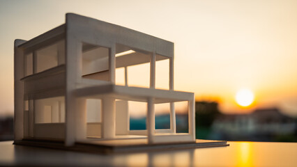 A white house made of foam sheets placed with a morning view of the village. The idea of...