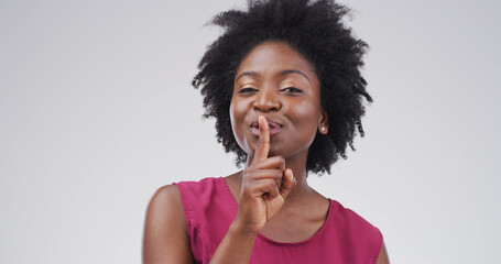 Hush, portrait and whisper with black woman on studio space for gossip, secret or silence. Emoji,...