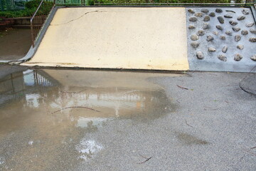 Tokyo Park: Puddle Under Slide After Rain (Everyday Trap)