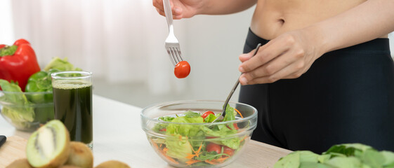 slim body women choose healthy foods, dieting female mixing salad on kitchen for diet. Good healthy...