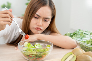 slim body asian women very bored diet food, dieting female choose low calories food for diet. Good...