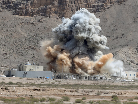 Demolition of industrial building creates large dust cloud