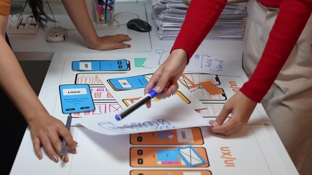 Designers working on user interface and user experience of mobile application