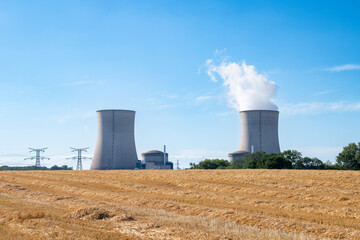 Nuclear power plant Cattenom in France, steaming cooling towers, air pollution, environment and energy industry